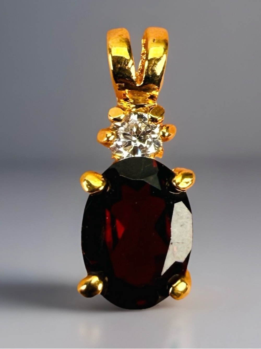 Beautiful Goldtone garnet red clear bling pendant
